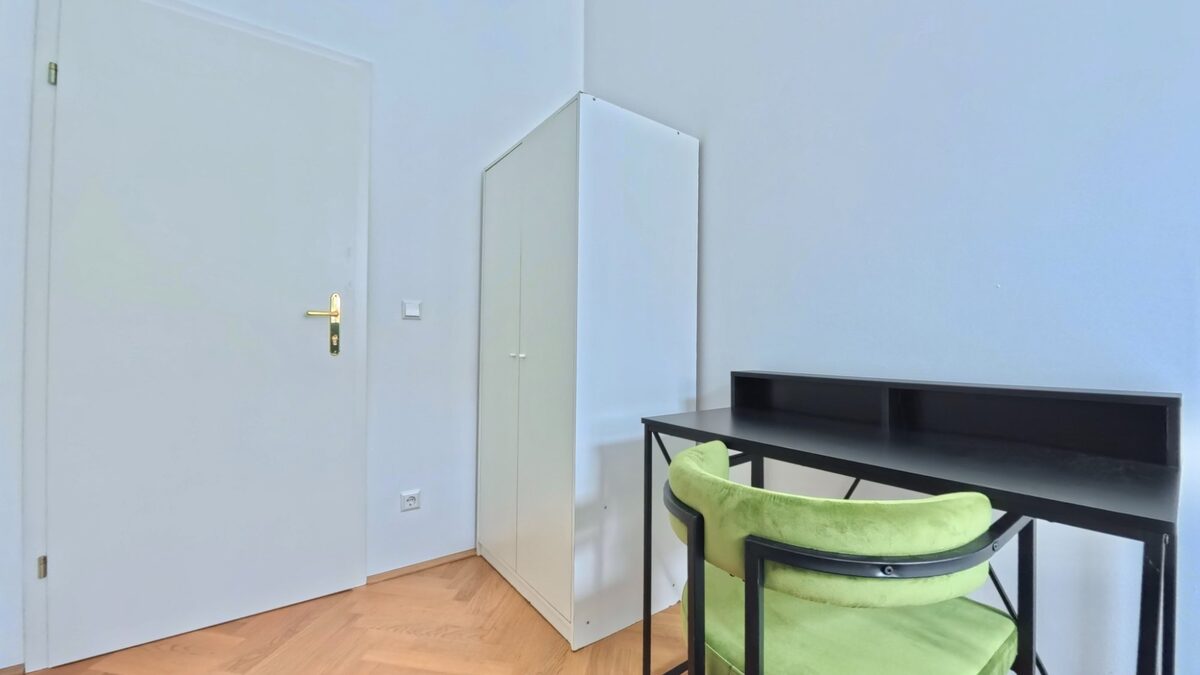 Room with closet and desk